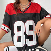 Person wearing a red, black, and white sports jersey with the number 89.